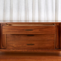Beautiful mid-century modern dresser. Vintage warm walnut furniture. Close-up front view with open...