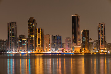 Fototapeta na wymiar Sharjah urban cityscape skyline night scene