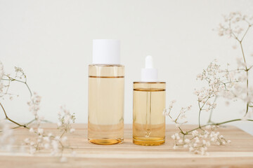 Korean skincare bottle mock up with natural flower.
