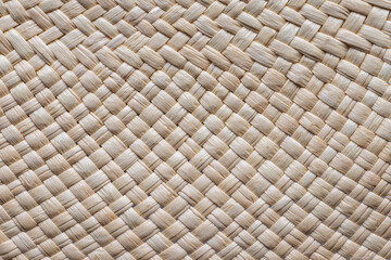 Closeup of woven beige color mat texture, full frame background