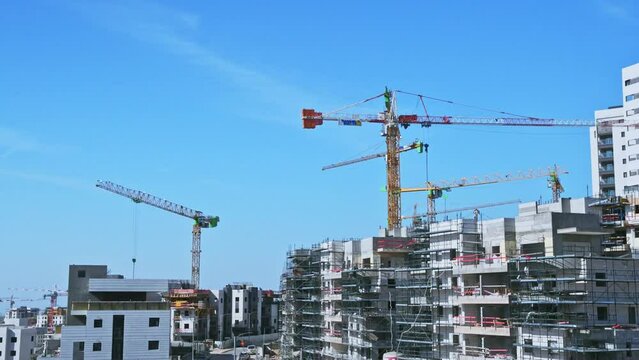 Modiin, Israel, January 12, 2023.Timelapse construction of infrastructure and a new residential area. Operation of tower cranes and construction equipment. High-quality FullHD footage