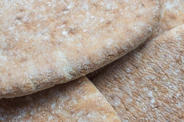 A stack of traditional pocket greek pita bread. Food background texture
