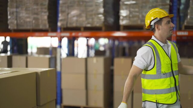 Teamwork of workers working in large warehouse retail store industry.Rack of stock storage. Interior of cargo in ecommerce and logistic concept. Depot. People lifestyle. Shipment service for container
