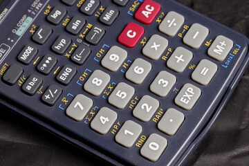 Close up advance calculator for engineer, math or business on black background