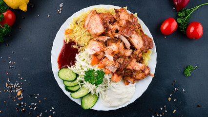 Chicken fillet with rice, tomatoes, cabbage, cucumbers, ketchup and mayonnaise.