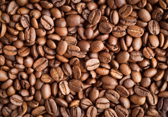 Roasted coffee beans, background, close-up, top view, flat lay.