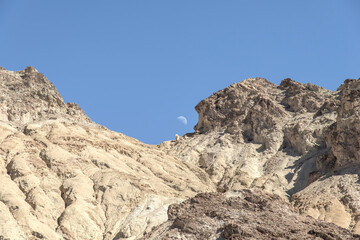 moon over mountain top in death valley