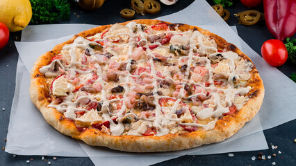 Italian pizza with shrimp, mushrooms, tomatoes, sweet peppers, lemon, cheese and sauce.