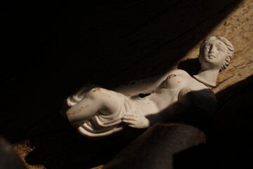 Broken statue of woman representing concept of violence      
