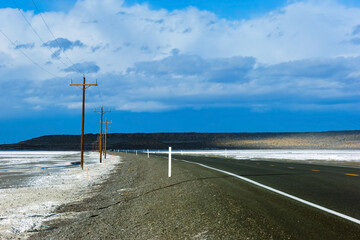 Salt flats and power lines along Highway 50 in Central Nevada, The loneliest road in America, USA