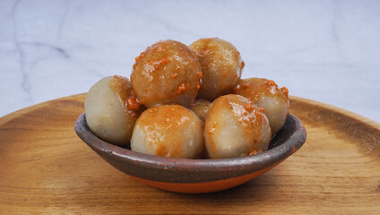 Cilok is one of Indonesian street food, served on clay plate