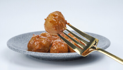Cilok on a fork isolated over white background. Cilok is a traditional food that comes from West Java Indonesia