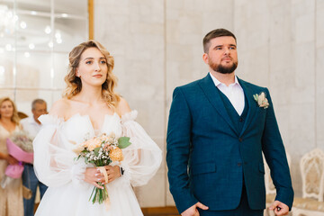 bride and groom before obtaining a marriage certificate in registry office. 