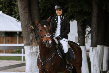 The horsewoman on a horse. Equestrianism. Horse riding. Horse racing. Rider on a horse.