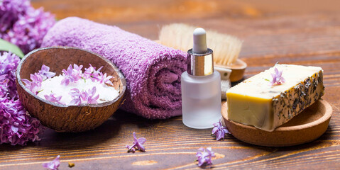 Lila spa setting with natural soap and pure essential oil - 568562909