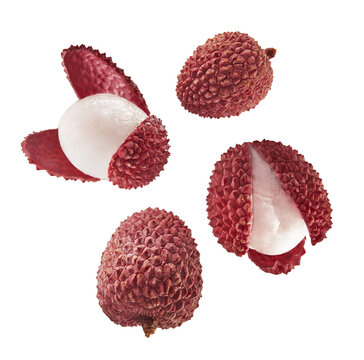 Fresh ripe red lychee falling in the air isolated