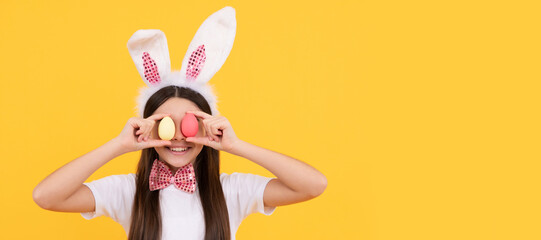 Pretty bunny. funny child in rabbit ears. smiling teenager girl in bow tie. bunny egg hunt. Easter...