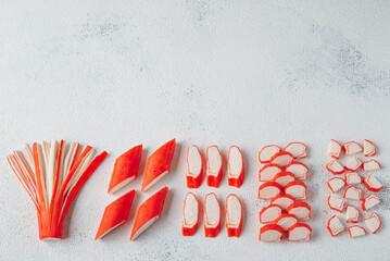 Crab sticks cutted food background © kovinka