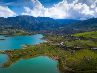 Aerial view of spring landscape of Zahara-el Gastor reservoir, artificial lake surrounded by...