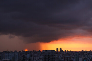 Fototapeta na wymiar Sunset over the city, before the storm