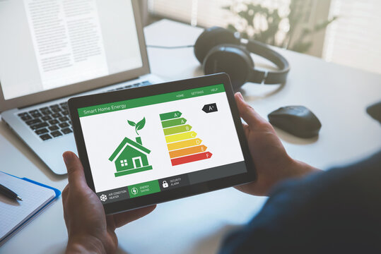 Energy efficiency mobile app on screen, eco house