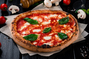 Italian pizza with mozzarella, tomato sauce, spinach on a thick dough with spices.