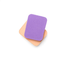 Makeup sponges isolated on white, top view