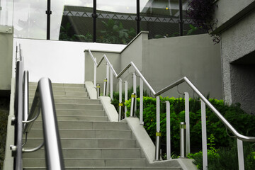 Outdoor staircase with metal handrails on city street