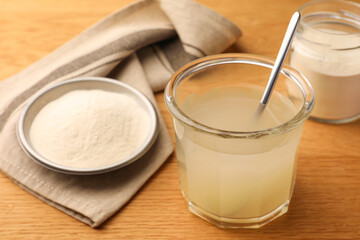 Agar-agar jelly and powder on wooden table, closeup