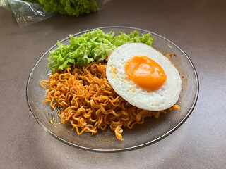 Fried Noodle with perfect Sunny-Side-Up Egg and vegetable