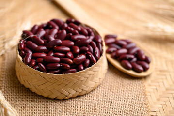 Red kidney beans seed in bamboo basket with spoon, healthy organic food ingredients