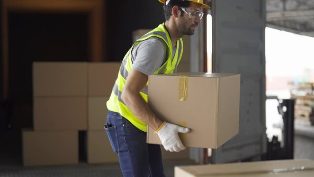 Portrait of middle east worker working in large warehouse store industry.Rack of stock storage. Interior of cargo in logistic concept. Depot. People lifestyle. Shipment service for container