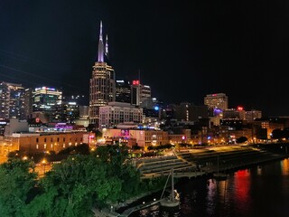 Fototapeta na wymiar The distance view of the downtown Nashville, Tennessee illuminated at night 