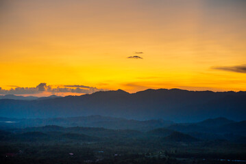 Sunset mountain range beautiful landscape mist, dusk golden time dramatic sky. Beautiful landscape high mountain ridge mist panning panorama scenery dawn dramatic sky. Sunrise landscape mountain peak.