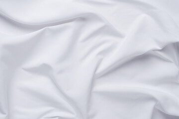 White fabric. luxurious white fabric texture background. Creases of satin, silk and cotton.