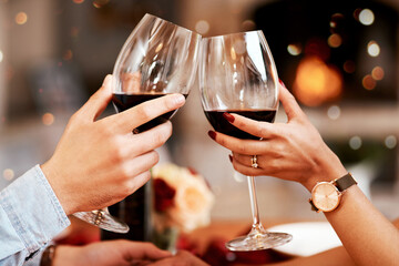 Red wine, glass and couple hands toast, celebrate or cheers in 5 star restaurant or fine dining...