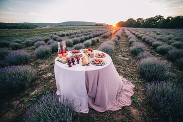 Wedding banquet in Provence style on a lavender field.