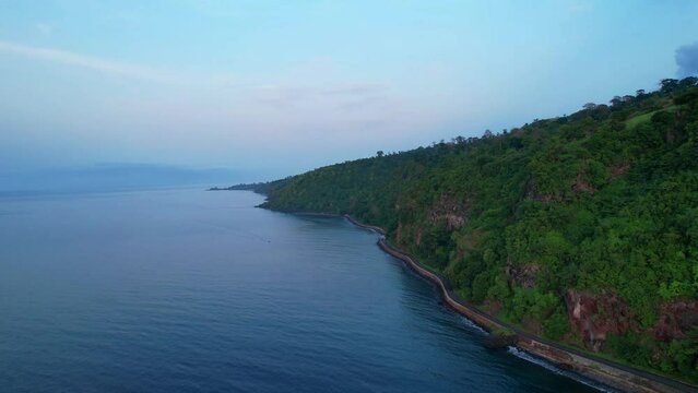 Flying over the sea at the north coast of Sao Tome, with view from the forest.Africa