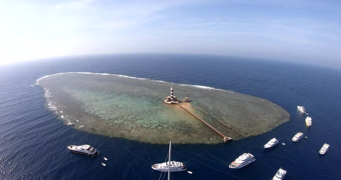 Aerial Drone Shot for the Daedalus Reef lies 180km south of Brother Islands. The reef is huge, surrounded by a sheer wall all around. shot on 4K and 50 Frames