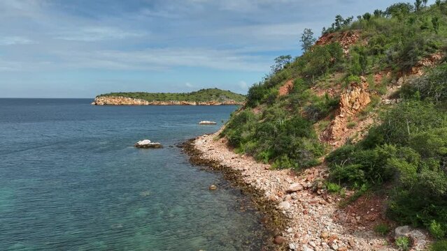 Aerial moving view of Playa Blanca beach in Mochima National Park, Venezuela.