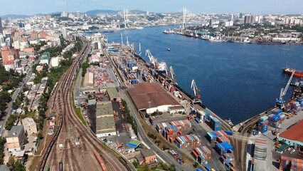 Fototapeta na wymiar Vladivostok, Russia - August 9, 2021: Top view. Commercial Sea Port. Industrial port with containers.