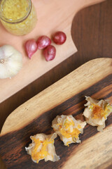 Flat lay of traditional chinese dimsum serve on a wooden table