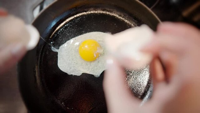 fried egg on a pig-iron . cooking fried eggs