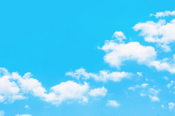 Naklejka na ściany i meble Heaven background. Cloudy sky background. Peaceful bright blue sky texture. Fluffy clouds on the sky background. Cloudscape view.