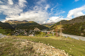 Fototapeta na wymiar A village in the mountains. The life of people in the mountains. Nature of Russia Caucasus. Bezengi Gorge.