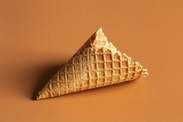 Texture waffle cone on brown background isolated.