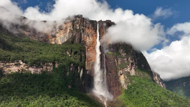 Camera moving closer to Angel Falls in sunlight in Canaima National Park, Venezuela.