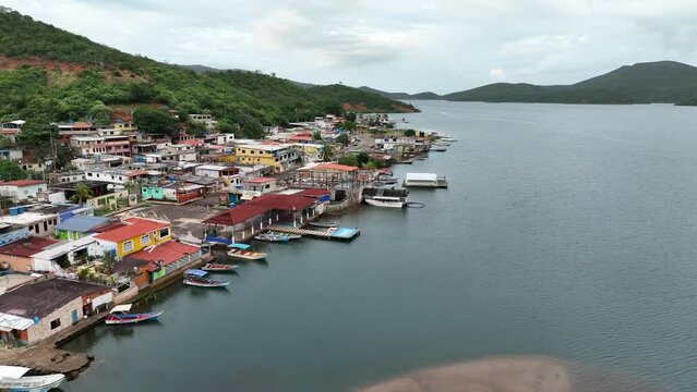Camera moving over the waterfront of small Venezuelan town Mochima in Mochima National Park, Venezuela.