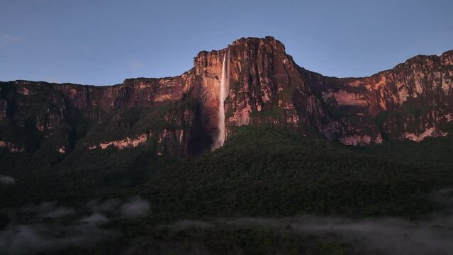 Camera moving from right to left showing Angel Falls just before sunrise in Canaima National Park, Venezuela.