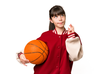 Little caucasian girl playing basketball over isolated background with fingers crossing and wishing the best